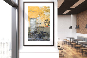 Rusted bike and colorful graffiti on Roman street