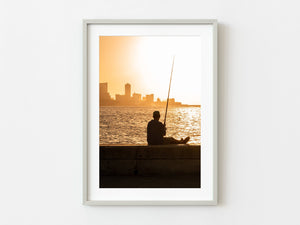 Cuban man fishing at sunset in Havana | Photo Art Print fine art photographic print