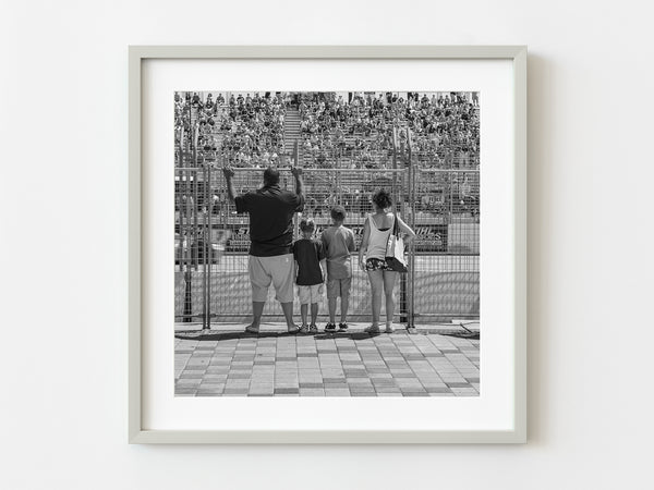 Family watching car race | Photo Art Print fine art photographic print