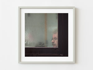 Man looking through a window | Photo Art Print fine art photographic print
