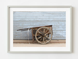 Old homemade metal wheel barrel against a wall in Beijing China | Photo Art Print fine art photographic print