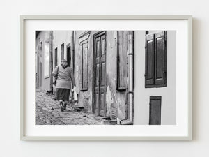 Old Romanian woman walks up a laneway | Photo Art Print fine art photographic print