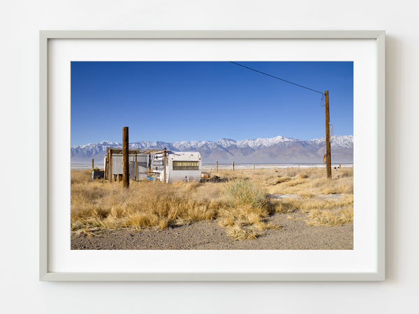 Old trailer parked under a blue sky | Photo Art Print fine art photographic print