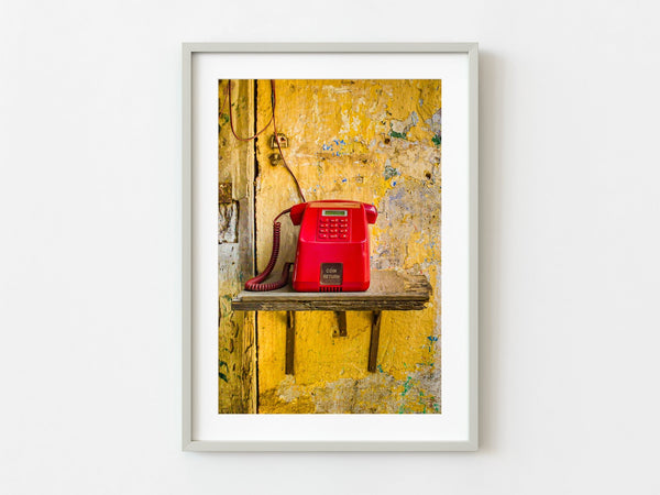 Red payphone on a broken shelf on a wall in Kochi India | Photo Art Print fine art photographic print