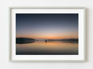 Sailboat sits in the water during a colourful sunset | Photo Art Print fine art photographic print