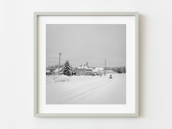 Snowmobiler driving down the road in Northern Canada | Photo Art Print fine art photographic print