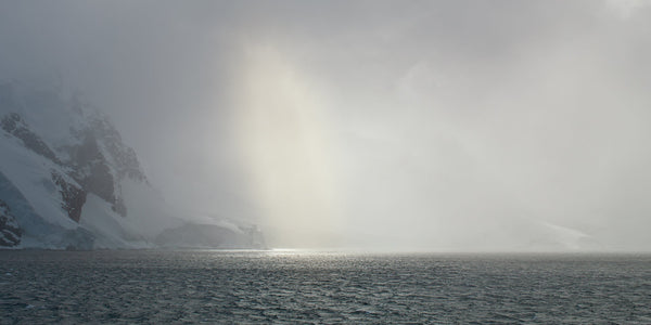 Sun breaks through the blowing winter storm in the Antarctic landscape | Photo Art Print fine art photographic print