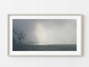 Sun breaks through the blowing winter storm in the Antarctic landscape | Photo Art Print fine art photographic print