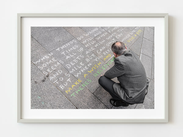 Well dressed Irishman writing message on sidewalk | Photo Art Print fine art photographic print