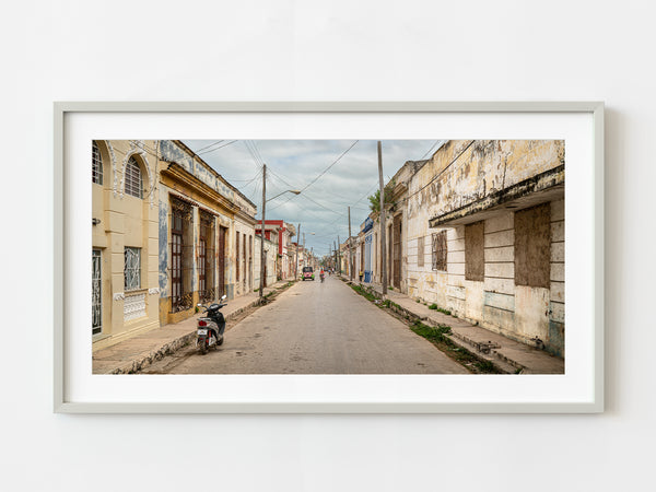 Woman cycling down the street in Cuba | Photo Art Print fine art photographic print