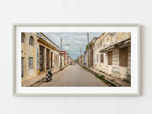 Woman cycling down the street in Cuba | Photo Art Print fine art photographic print